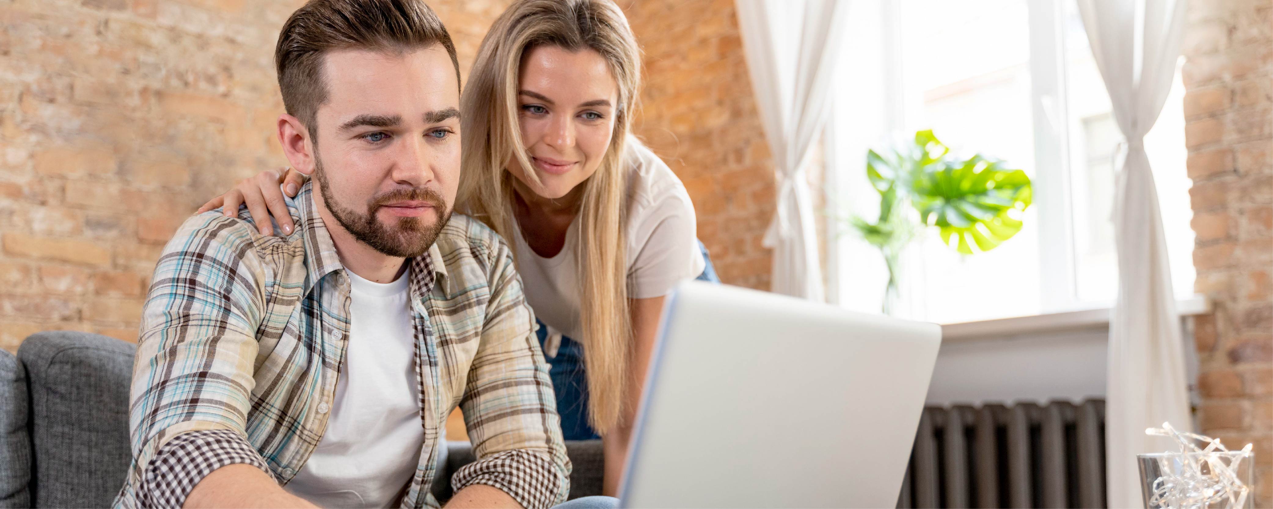 Couple looking at laptop