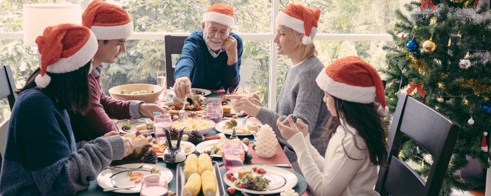 A family cooking and preparing Christmas dishes together for the holidays